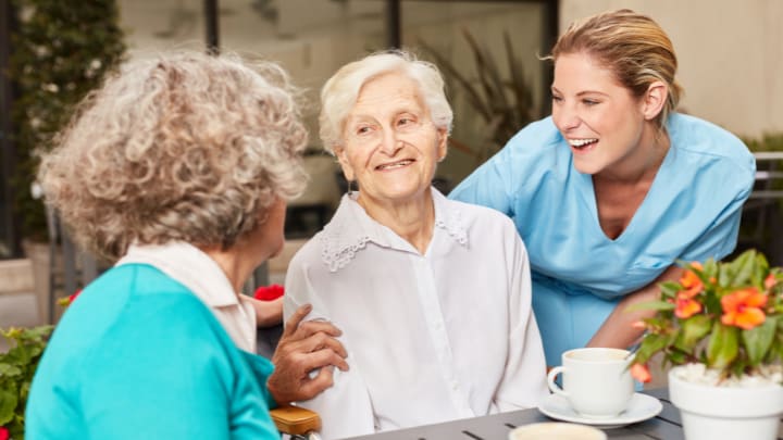old woman laughing to each other