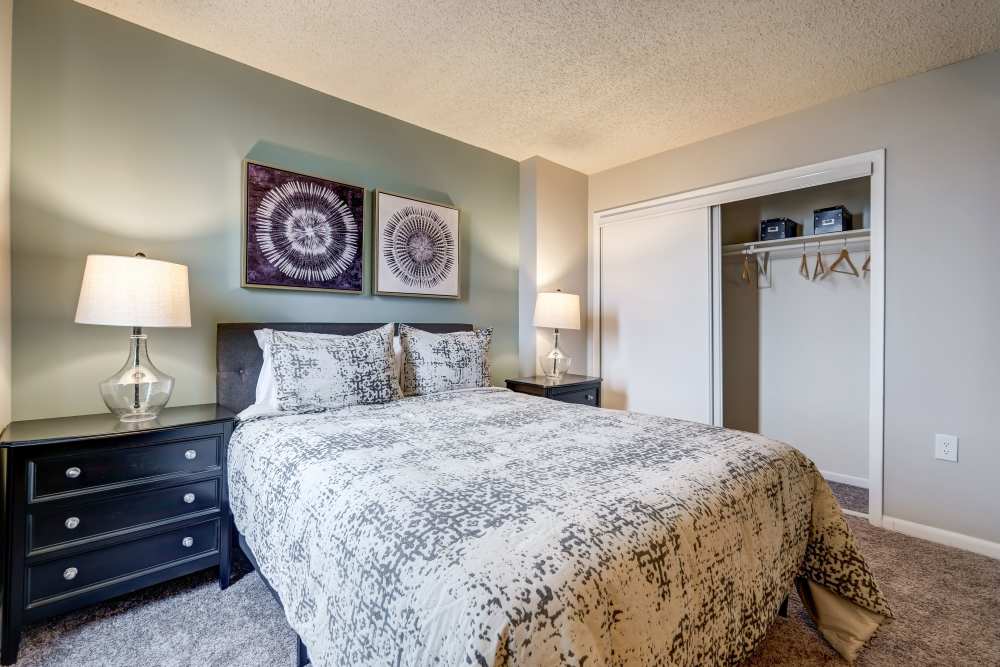 Staged bedroom with carpet at River Park Tower Apartment Homes in Newport News, Virginia