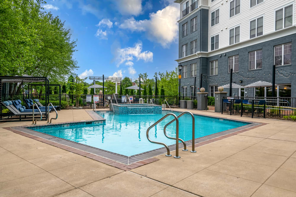 Swimming pool and spa on a beautiful day at Sofi at Morristown Station in Morristown, New Jersey