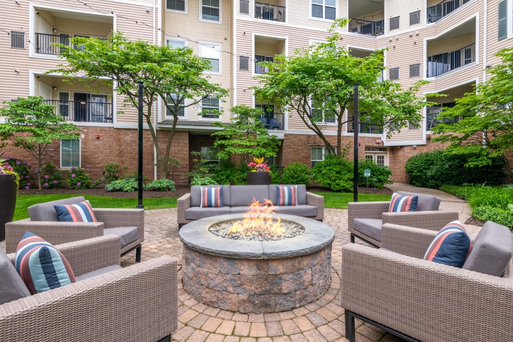 Fire pit with lounge chairs Sofi Gaslight Commons in South Orange, New Jersey