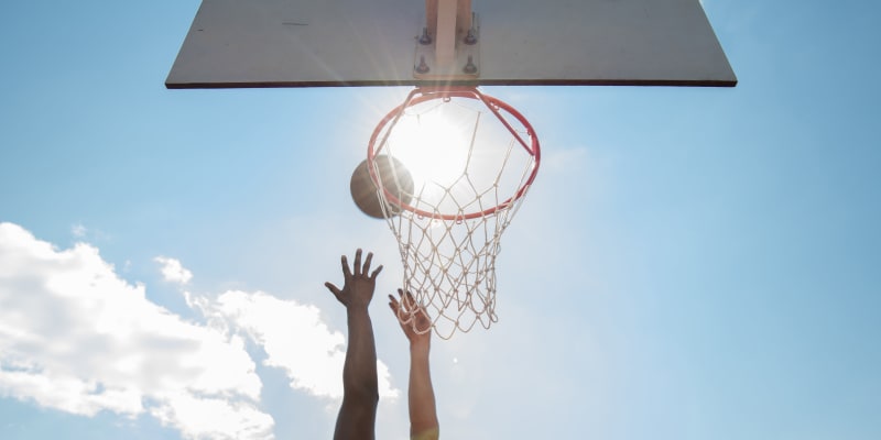 Residents playing basketball near Ben Moreell in Norfolk, Virginia