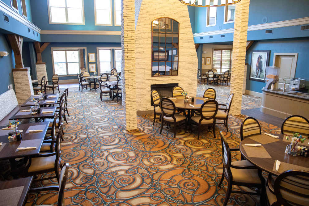 A senior looking over a menu at Watercrest at Kingwood in Kingwood, Texas