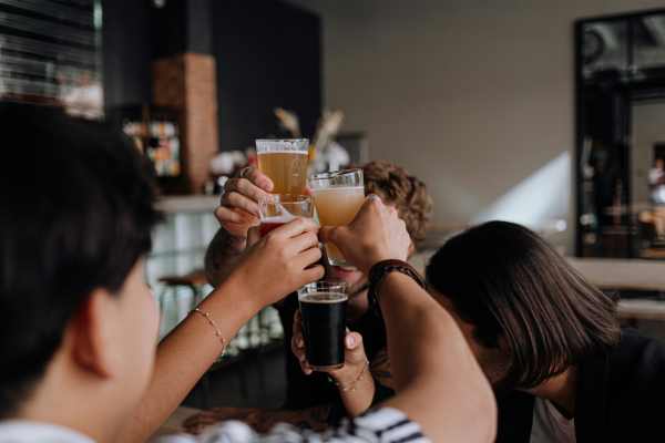 Residents having drinks in bar near Domain Memorial in Houston, Texas