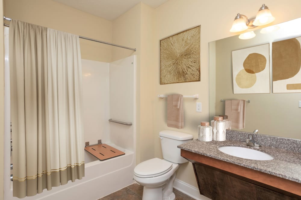 Bathroom with big mirror at Sage Creek Apartments in Augusta, Georgia
