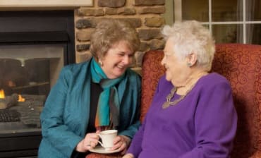 Two residents catching up at The Meridian at Boca Raton in Boca Raton, Florida.