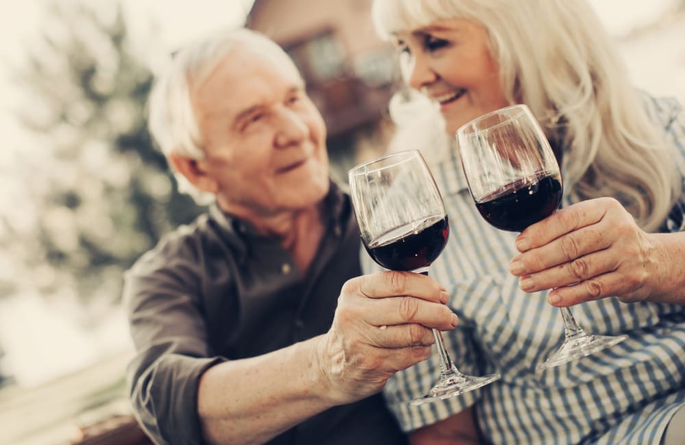 Resident couple toasting to their decision to live at Palo Alto Commons in Palo Alto, California