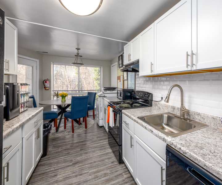 Kitchen with stainless steel sink at Knights Bridge II in Burtonsville, Maryland