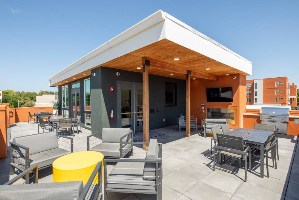 Outdoor seating with fireplace, tv and bbq at Solasta in Sacramento, California