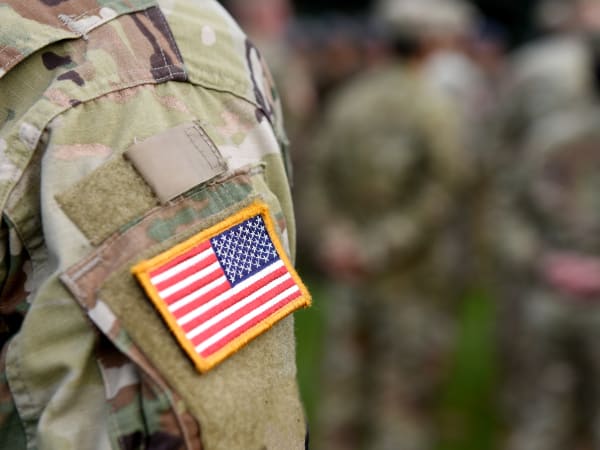 Military resident honoring a fallen comrade with his squad near Brio Apartment Homes in Glendale, California