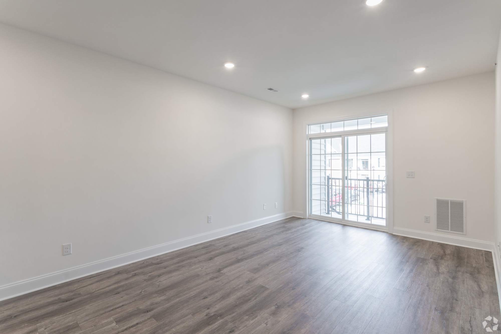 Wide Living Room with Wood Flooring at The Residences at St. Joseph Court in Levittown, Pennsylvania