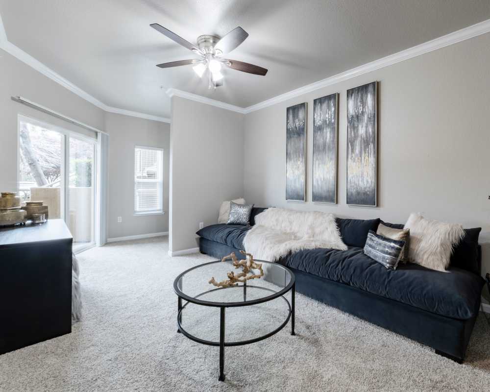 Living room with ceiling fan at Ashton Parc in Sacramento, California