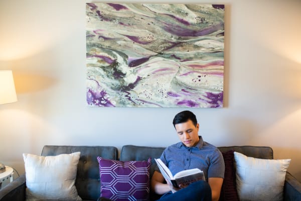 Resident enjoying a book in his new home at Remington Ranch in Litchfield Park, Arizona