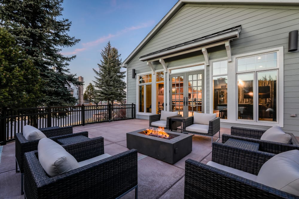 Patio with chairs an a fire pit at Marquis Castle Pines in Castle Pines, Colorado