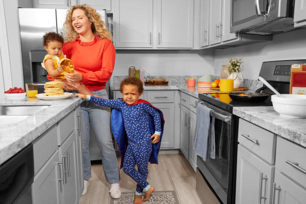 Resident and kids enjoying her kitchen at BB Living at Eastmark in Mesa, Arizona