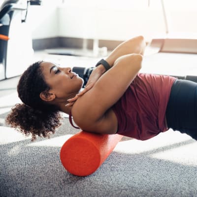 Woman working up a sweat in the fully-equipped fitness center at The Reserve at Patterson Place in Durham, North Carolina