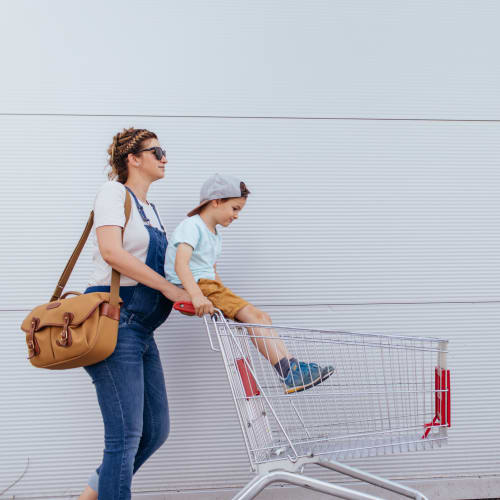 A mother and her son outside of a grocery store near Joshua Heights in Twentynine Palms, California