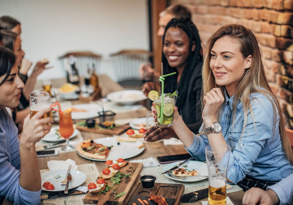 Residents and friends enjoying a meal at a favorite local restaurant near Castlegate Collier Hills in Atlanta, Georgia