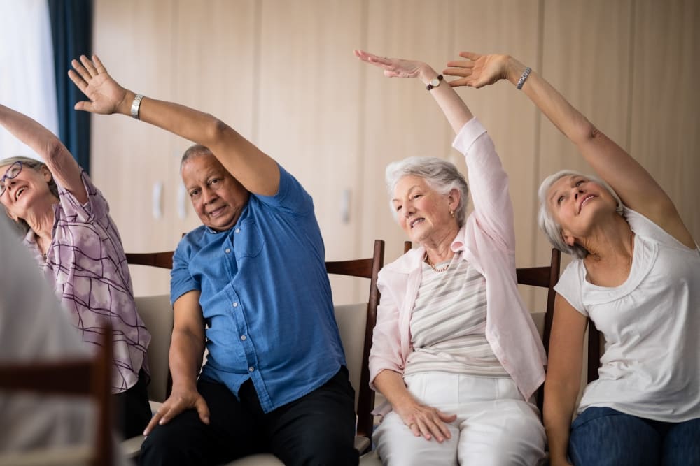 Residents enjoying an exercise class at Holden of Bellevue in Bellevue, Washington