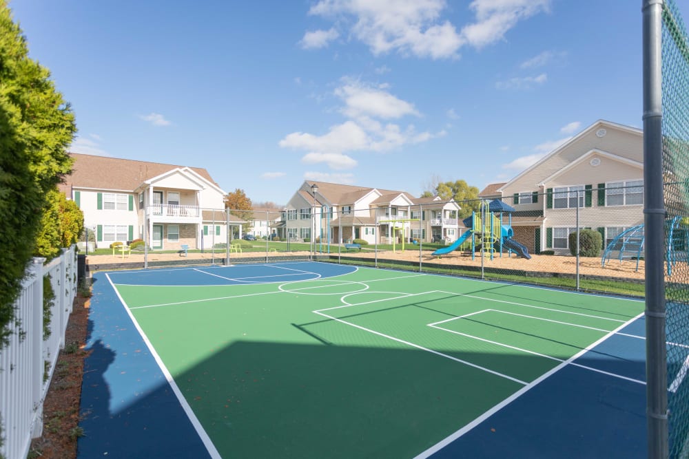 Outdoor basketball court and playground at Westview Commons Apartments in Rochester, New York