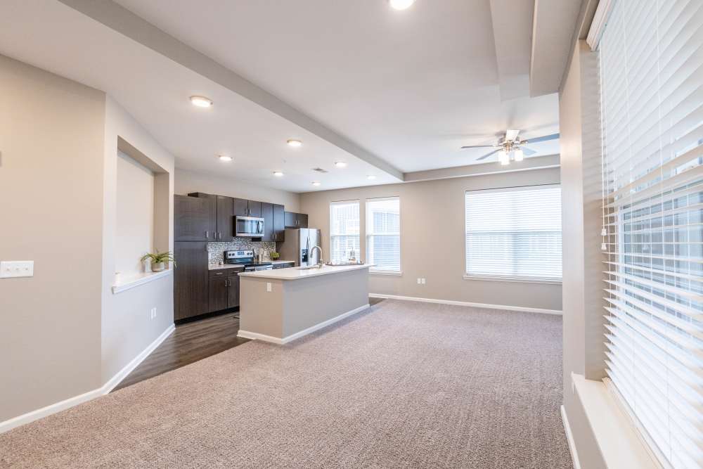 Kitchen with hard wood flooring and large windows atVillas On Fir in Granger, Indiana