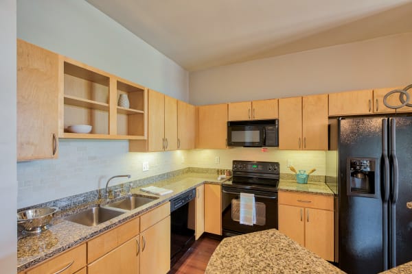 Kitchen with an island at Downtown Belmar Apartments