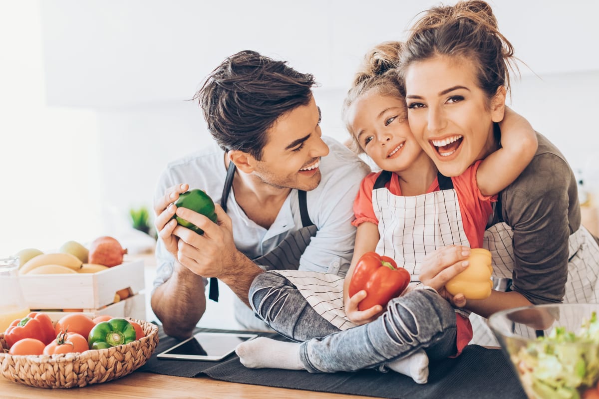 Family in the kitchen at 6 West Apartments in Edwards, Colorado