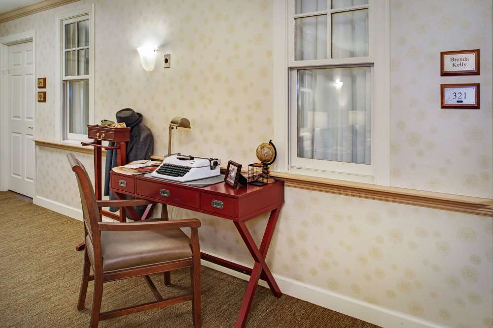 Work area with desk and chair in a quiet space at Glenncrest at Johns Creek in Johns Creek, Georgia