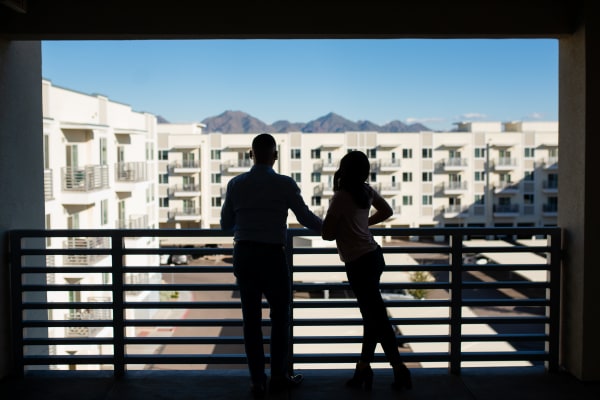 Residents admiring the view from their private balcony at Slate Scottsdale in Phoenix, Arizona