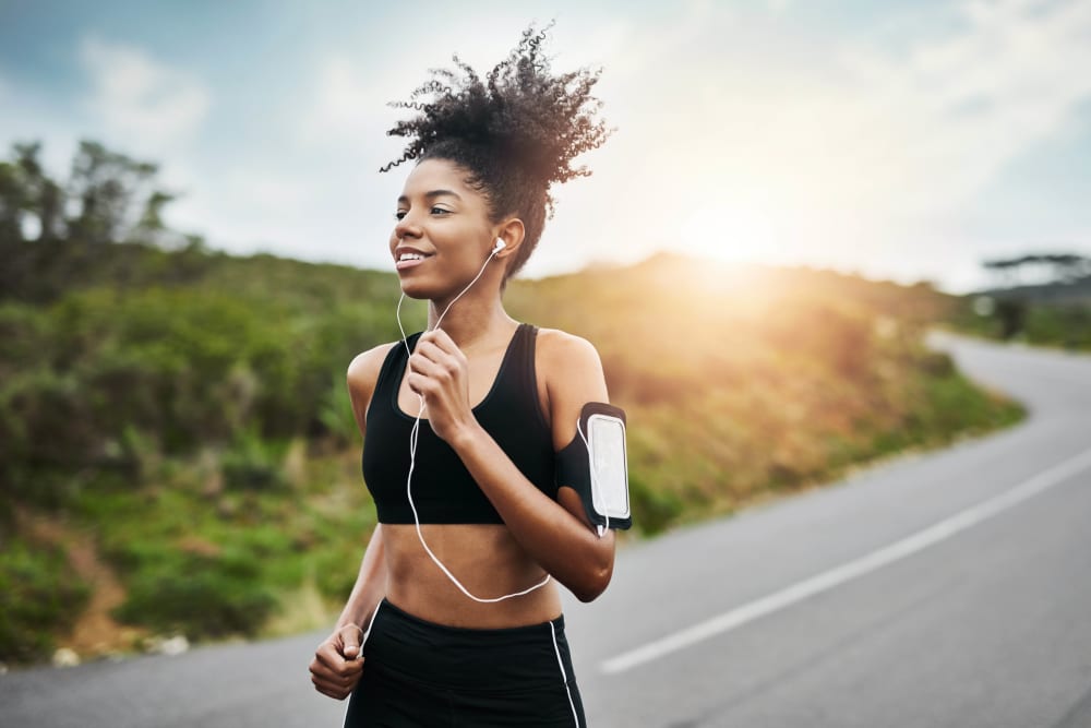 Resident running near Summerhill Terrace Apartment Homes in San Leandro, California