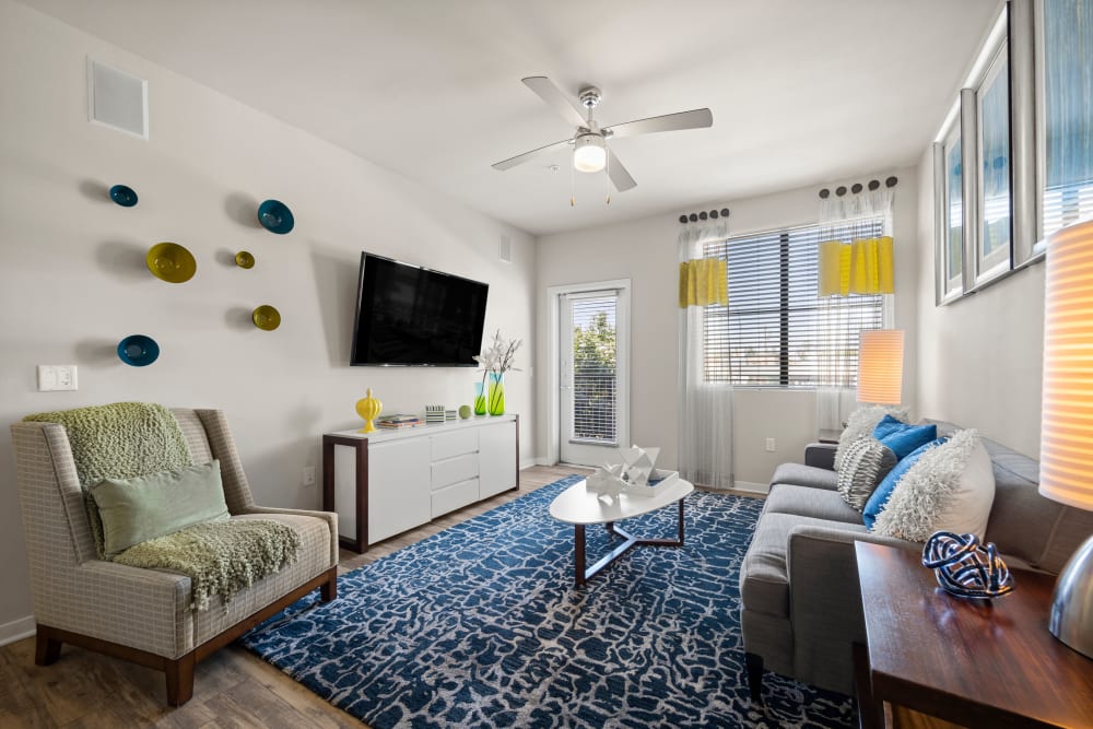 Bright and welcoming open-concept floor plan in a model apartment at Olympus Steelyard in Chandler, Arizona