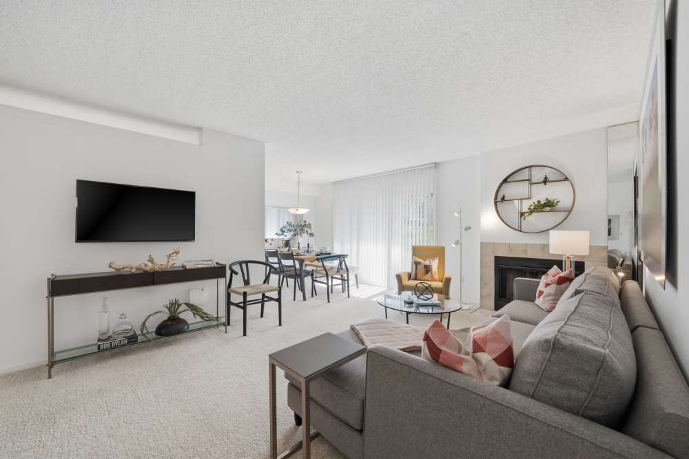 Living room with sofa, TV, and open layout at Citation Club in Farmington Hills, Michigan