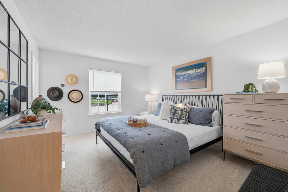 Bedroom with dresser and wall decor at Citation Club in Farmington Hills, Michigan