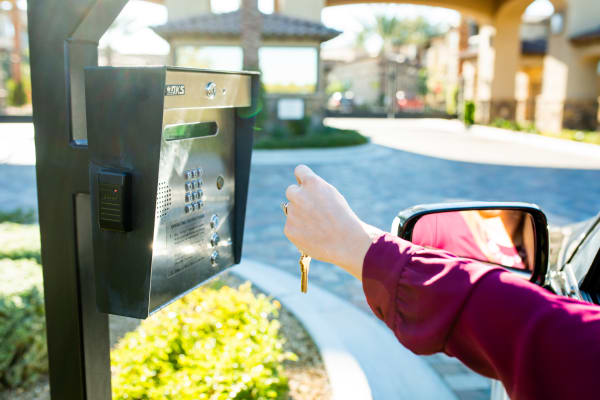 Resident accessing their new community through the gated entrance at San Pedregal in Phoenix, Arizona