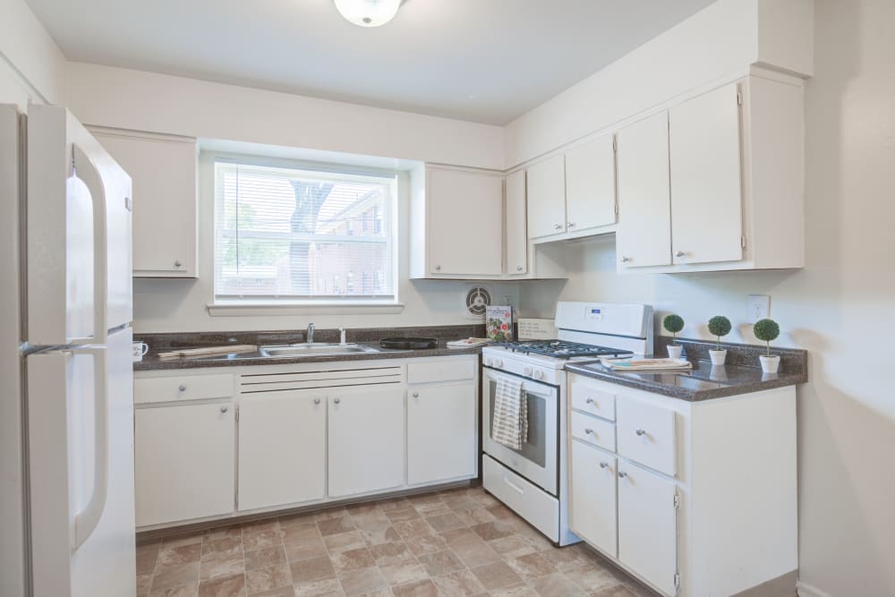 Beautiful modern kitchen with white appliances at Lakeview Terrace Apartment Homes in Eatontown, New Jersey