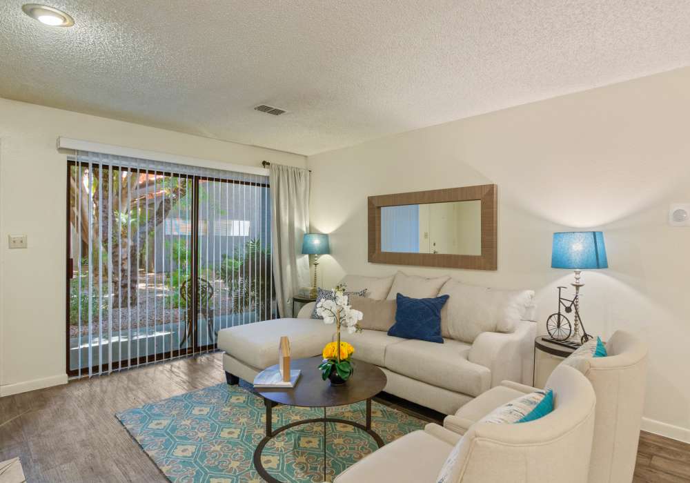 Living room with couch at Waterford Place Apartments in Mesa, Arizona