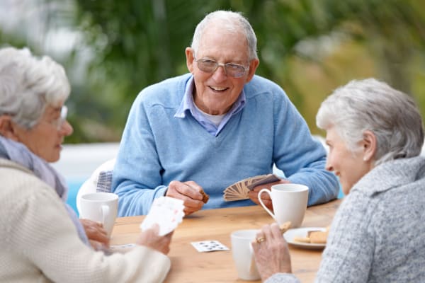 Residents playing cards at WellQuest of Granite Bay in Granite Bay, California