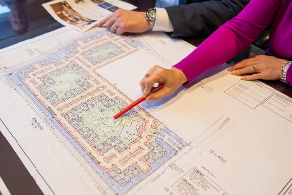 Executives working on the site plan for another Mark-Taylor development