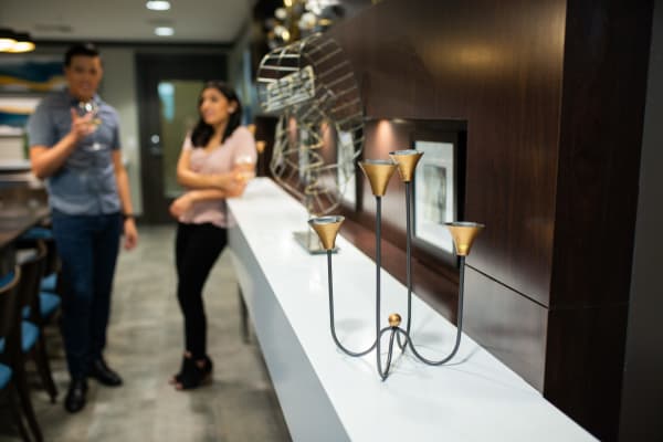 Resident drinking wine at a beautiful gallery near San Milan in Phoenix, Arizona