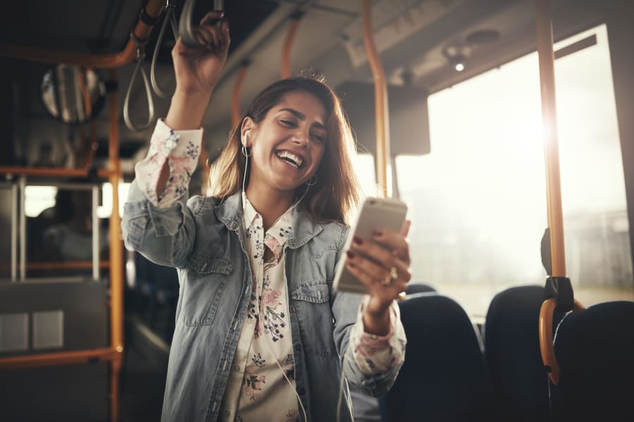 Resident student riding the bus to school from a transit stop very close to The Landmark Apartment Homes in Sunnyvale, California