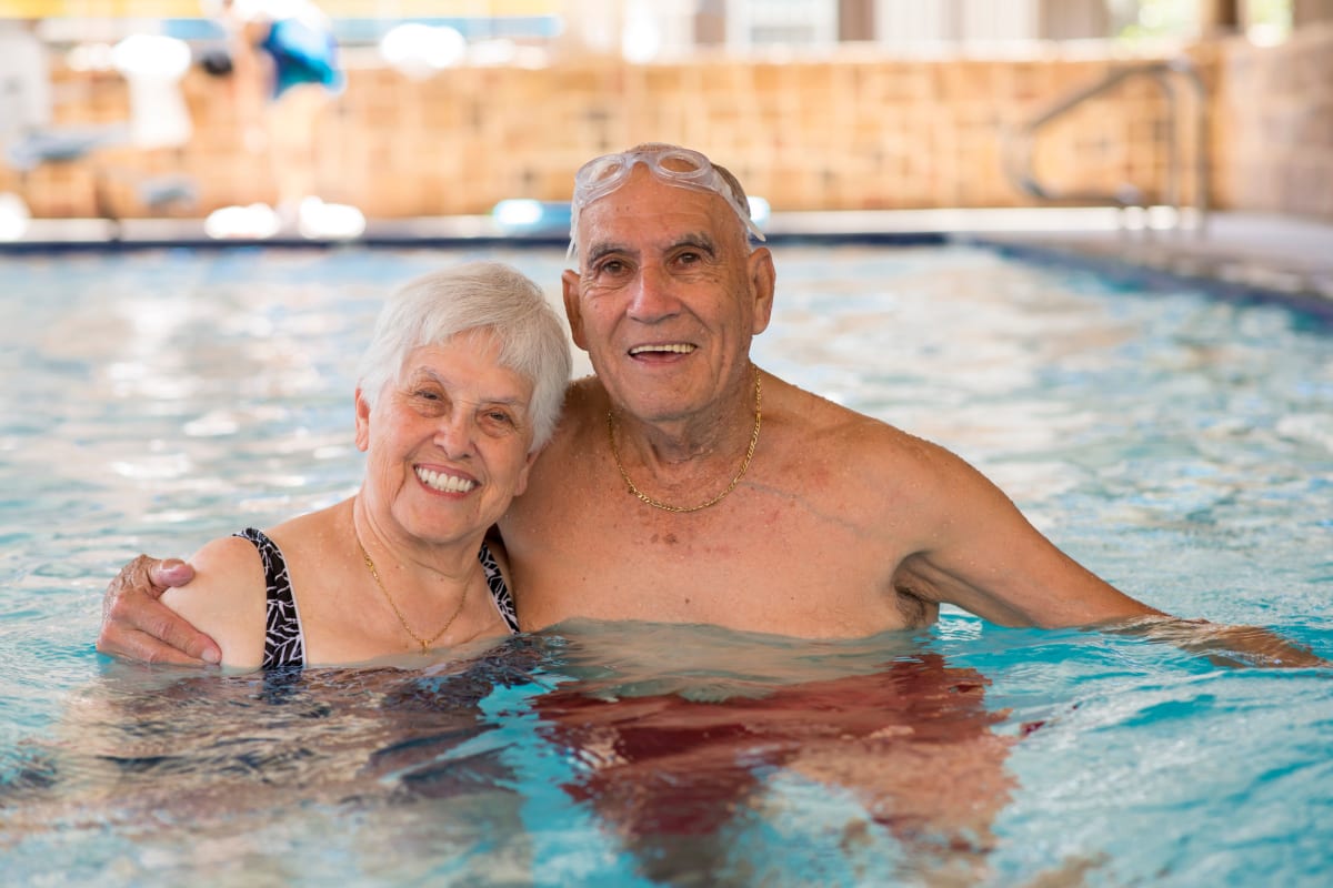 Couple enjoying the swimming pool at Watermere at Round Rock in Round Rock, Texas