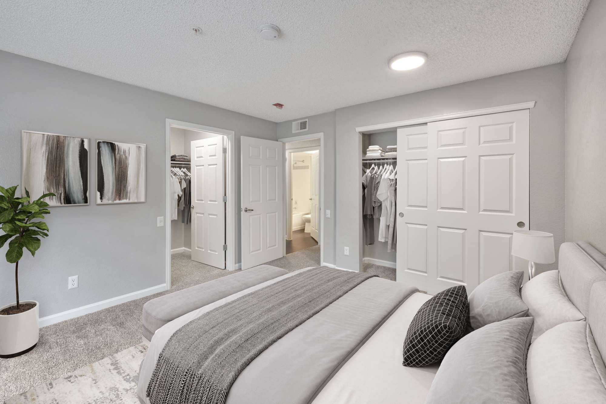 Well-furnished bedroom at Arapahoe Club Apartments in Denver, Colorado