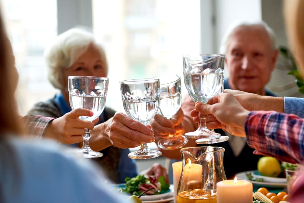 Residents toasting over breakfast at Meridian Senior Living in Bethesda, Maryland