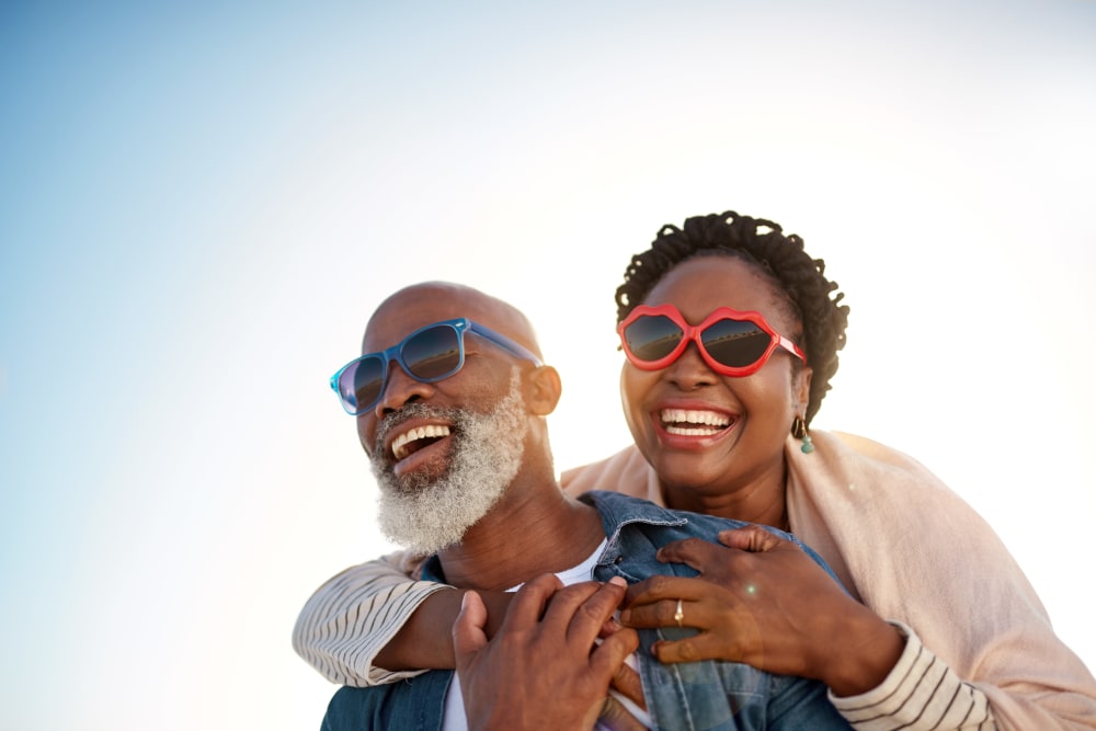 Residents enjoying the outdoors with fun sunglasses together near Mariposa at Clear Creek in Webster, Texas