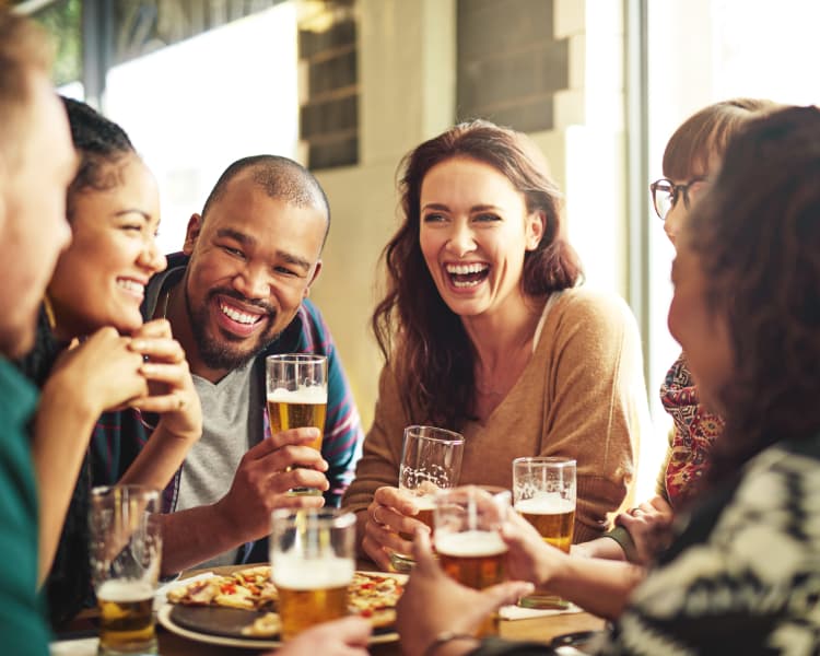 Group of people having a drink near Broadstone Heights