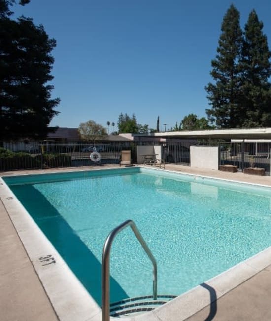 Swimming pool area at Arden Palms Apartments in Sacramento, California