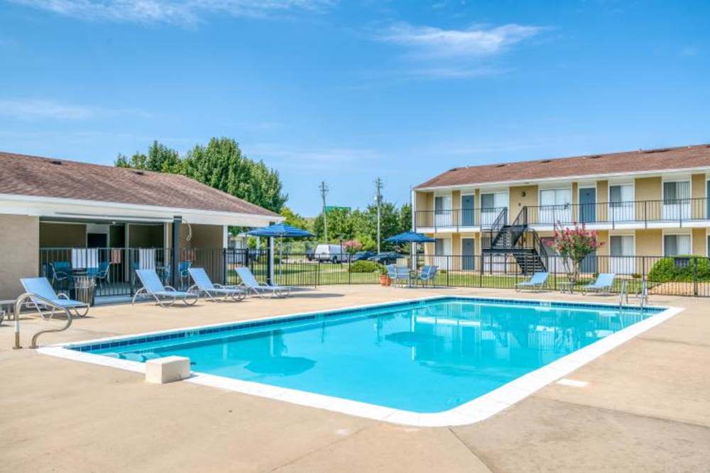 Swimming pool with lounge chairs at Alcove in Montgomery, Alabama