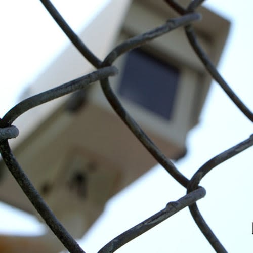 Security camera behind a chain link fence at Red Dot Storage in Richton Park, Illinois