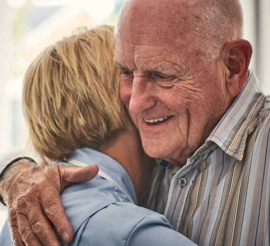 Resident couple hugging at The Village at Hayes Valley in San Francisco, California