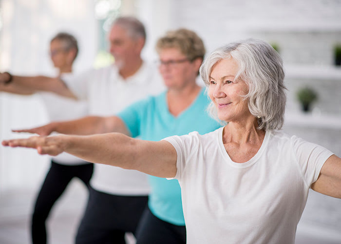 Seniors exercising at Avenida Naperville senior living apartments in Naperville, Illinois