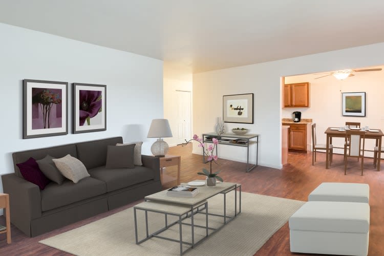 Spacious, well-lit living room at Wedgewood West in Rochester, New York